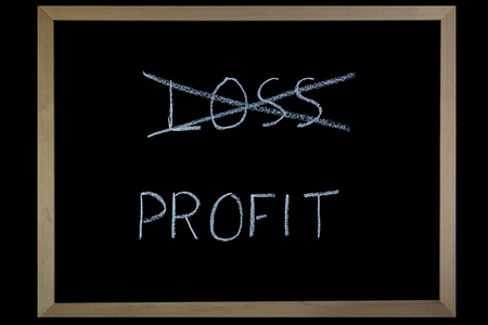 Words Loss and Profit  written on a blackboard with chalkの写真素材