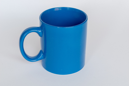 Blue mug isolated on a white backgroundの写真素材