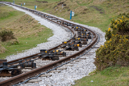 Close view of tram rail tracks showing the cable system which pulls the trams alongの写真素材