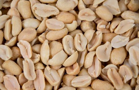 Salted and roasted peanuts background