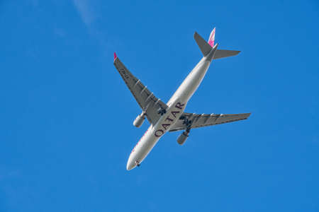 LONDON, UNITED KINGDOM - SEPTEMBER  28, 2021: Qatar Airways Airbus A330 underside image on approach to Heathrow Airportのeditorial素材