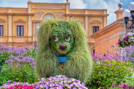 Lady character topairy displayed at Epcot at part of the Flower and Garden festival