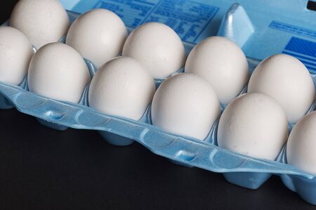One dozen Grade A extra large white eggs in carton
