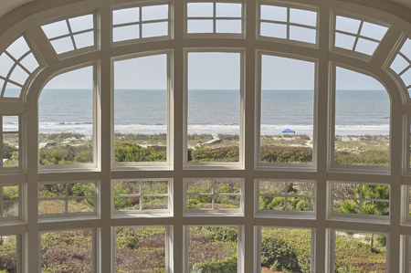 living room large window overlooking ocean frontのeditorial素材