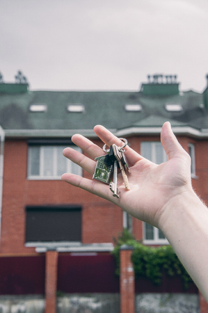 The key in hand and the big houseの写真素材