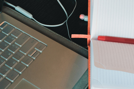 Notebook with laptop closeup, workplaceの写真素材
