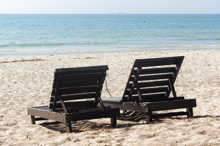 wooden beach chairs on beautiful island in white sand plageの写真素材