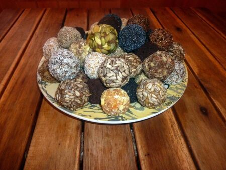 Candies of dried fruits and nuts on a wooden table. Healthy eatingの写真素材