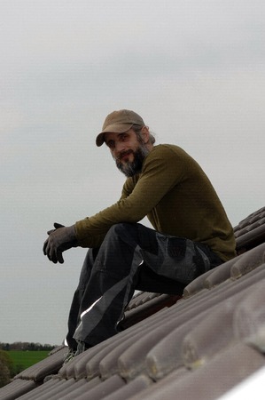 Roofer resting on top of a roofの写真素材