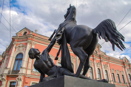 a View of Horse tamers monument by Peter Klodt on Anichkov Bridge in Saint-Petersburg Russia. Popular touristic landmark.の写真素材