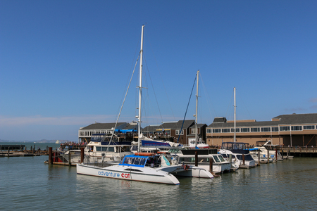 the fishermans wharf on Pier 39 is a shopping center and popular tourist attraction built on a pier in San Francisco, California.の写真素材