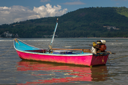 a pink boat on Kamala Beach in Thailand, Phuket islandの写真素材