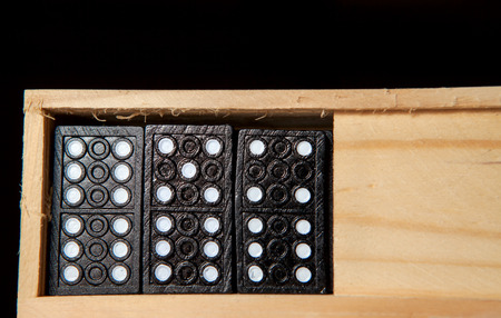 Domino in wooden boxの写真素材
