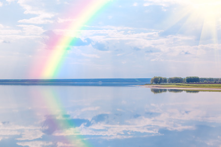 rainbow over the lakeの写真素材