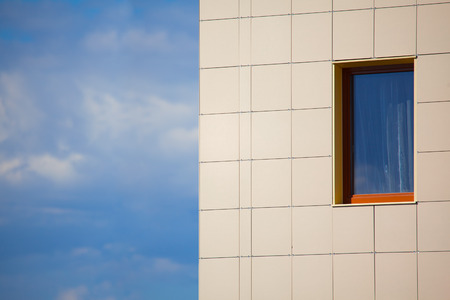 window against blue and yellow background