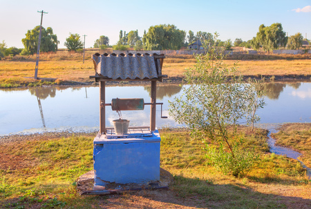 water well on the river shoreの写真素材