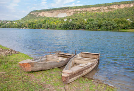 two wooden boats on the shoreの写真素材