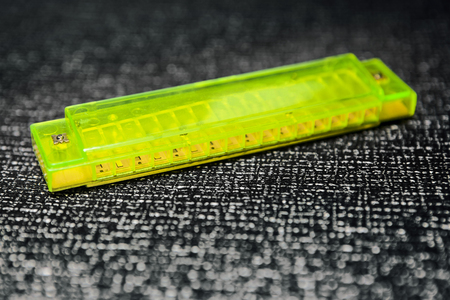 green toy harmonicaの写真素材
