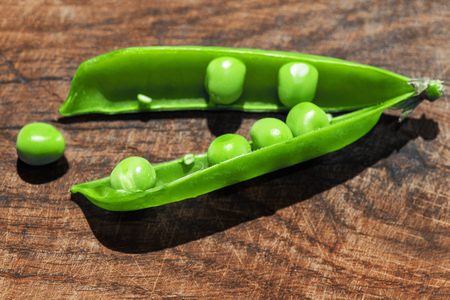 peas on the wood surfaceの写真素材