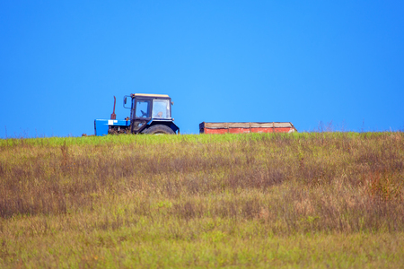 tractor on the hillの写真素材