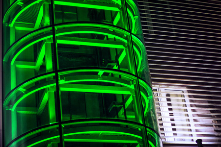 elevator shaft in green neon lightの写真素材