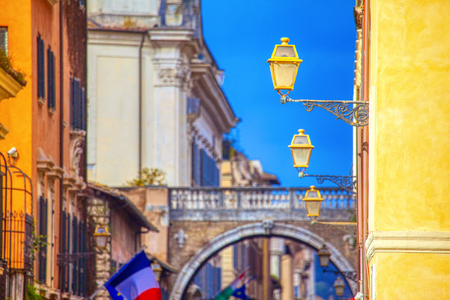 European alley with flags and street lampsの写真素材