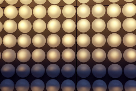 white lighting spheres in rowsの写真素材