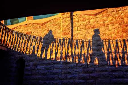 shades of passing people on the wallの写真素材