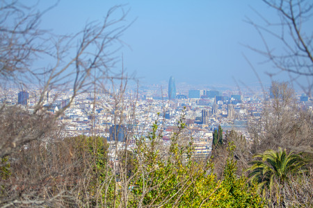 View of Barcelona panorama through the branchesのeditorial素材