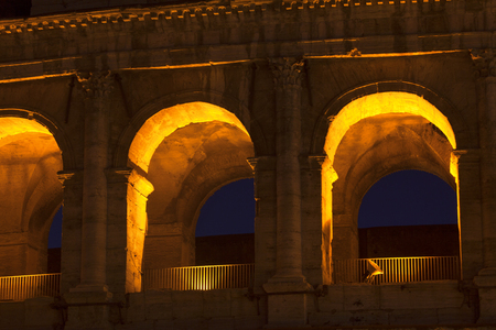 Illuminated arches of ancient architectureの写真素材