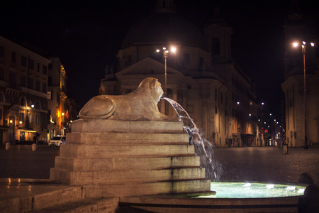 night view of Lion fountain in Piazza del Popolo from Romeの写真素材