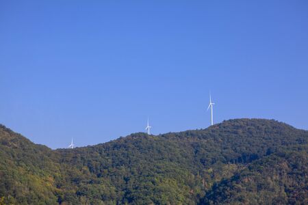 wind turbines on the green mountainの写真素材