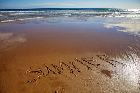 inscription summer on the sandy beachの写真素材