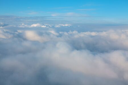 view of the of the cumulus clouds from the airplane window