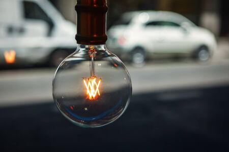 vintage filament bulb hanging in the urban cafe