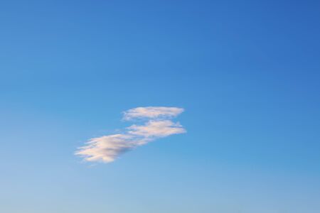 one white cloud on the blue sky