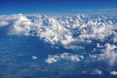 fluffy white clouds high in the sky