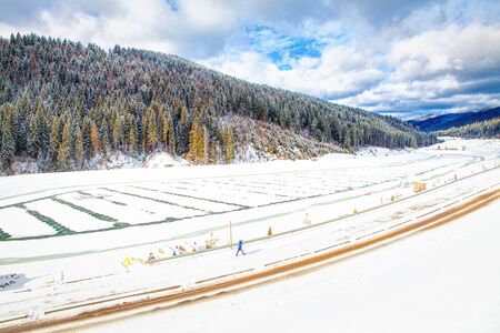 walking along the frozen lake in the cold winterの写真素材