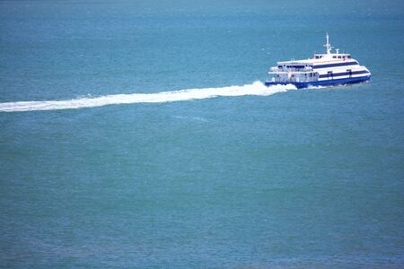 modern passenger boat speeding on the seaの写真素材