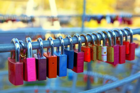 colorful hanging locks on the bridgeの写真素材