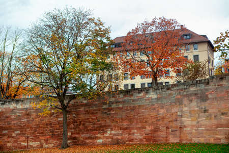autumn scene , bricks wall and residential house