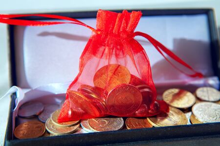 coin collection in decorative bag