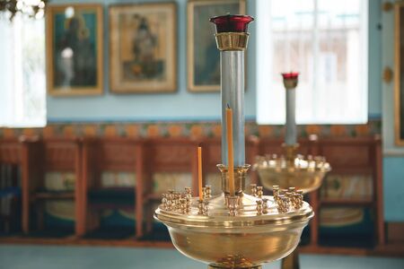 candelabra in a church with not burning candles