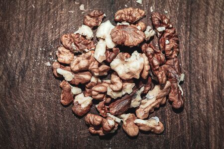 pile of cleaned walnut kernels at the wooden tableの写真素材