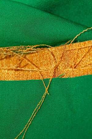 fabric pieces with threads and textile backgroundの写真素材