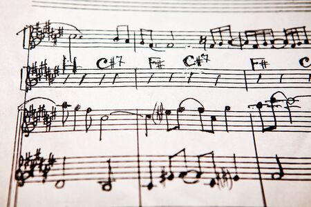 handwritten musical score . Sheet music of musical opus . Sheet music and accords om a paperの写真素材