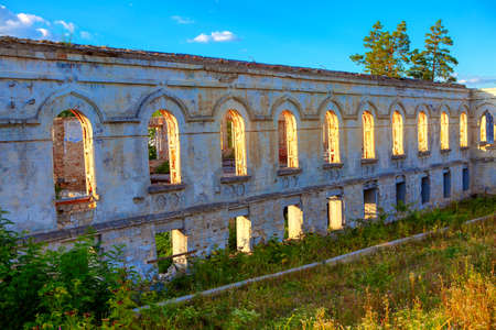 Ruined wall with arched windows , part of old church