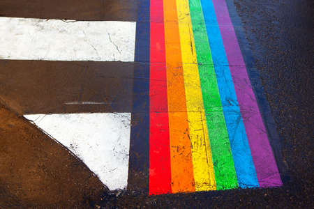 Rainbow colored pedestrian crossing . Road markings in the Parisian Maraisの写真素材