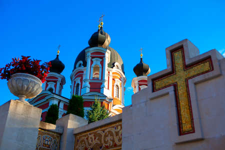 Majestic Monastery Curchi from Moldova . Religious background with church and cross symbol