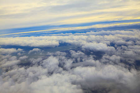 Clouds from Airplane Window . Flight over the clouds and riverの写真素材